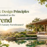 Luxury biophilic farmhouse surrounded by lush greenery, natural stone, water features, and mountain views, illustrating biophilic design principles in India.