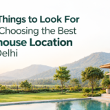 Luxury farmhouse location near Delhi with landscaped greenery, a modern farmhouse, pool, and natural surroundings.